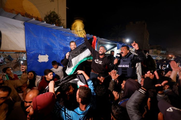 Palestinians react to news of a ceasefire deal in Khan Younis, southern Gaza, on Wednesday.